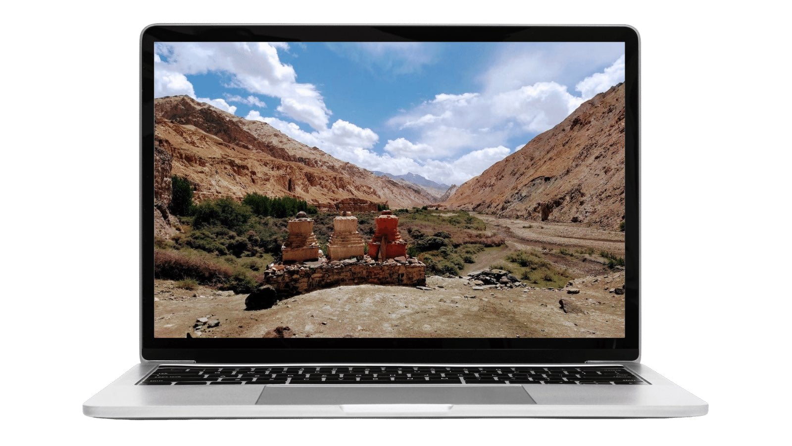 Laptop with background of buddhist stupas in the mountains | Web design